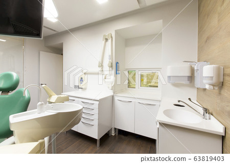 Sink, soap and sanitizer for dentist in modern hospital room Sink, soap and sanitizer for dentist in modern hospital room 63819403