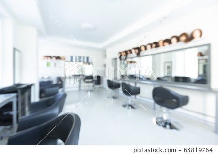 Blurred interior of beauty salon with large mirror 63819764