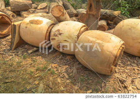.Turning a tree to make a drum .Turning a tree to make a drum 63822754