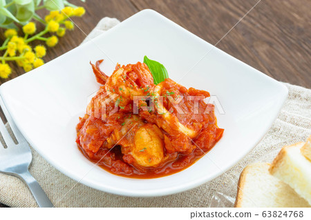 Boiled seafood in tomato sauce 63824768