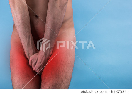Man Covering His Crotch. the concept of male illness. prostate cancer. impotence. 63825851