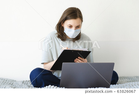 Coronavirus. Quarantine. Girl and distance learning. Studying online. Coronavirus. Quarantine. Girl and distance learning. Studying online. 63826067