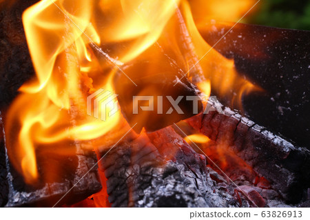 Close-up burning firewood in fire, black coals Close-up burning firewood in fire, black coals 63826913