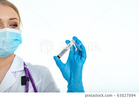 A nurse s hand in a glove holds a test tube with A nurse s hand in a glove holds a test tube with 63827894