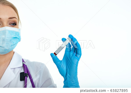 Doctor's hand in a medical glove holds a test tube Doctor's hand in a medical glove holds a test tube 63827895