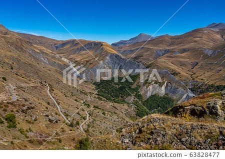 View of the mountains around Alpe d'Huez in the View of the mountains around Alpe d'Huez in the 63828477
