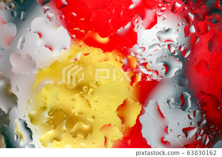 water drops on a multicolored background macro 63830162