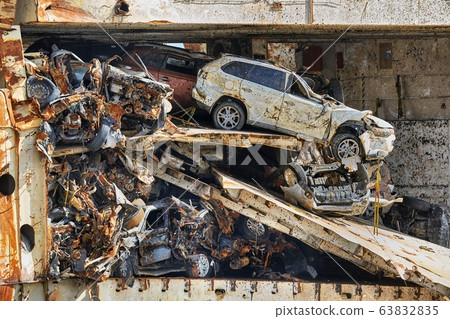 Pile of smashed car wrecks 63832835