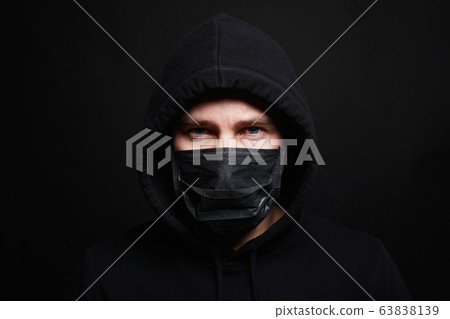 Man in Mask and Hood. Boy in Black Mask and Hoodie Man in Mask and Hood. Boy in Black Mask and Hoodie 63838139