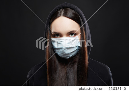 Woman in Mask and Hood. Girl in medicine Mask and Woman in Mask and Hood. Girl in medicine Mask and 63838140