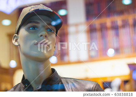 Realistic male mannequin stand in a store. Sales 63838818