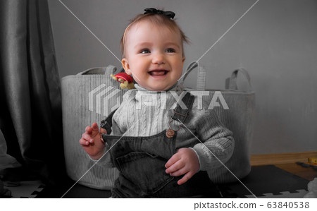 Cutie little baby girl smiles at home Cutie little baby girl smiles at home 63840538