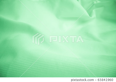 Shiny flowing cloth texture in macro shot. 63841960