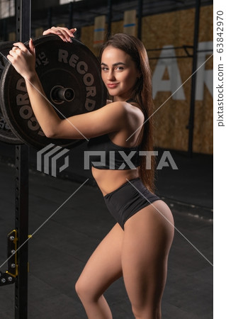 Young woman training in a gym view 63842970