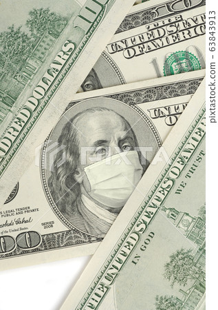 Portrait of Franklin on 100 dollar banknote with medical mask 63843913