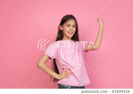 Caucasian little girl portrait isolated on pink studio background, emotions concept Caucasian little girl portrait isolated on pink studio background, emotions concept 63844426
