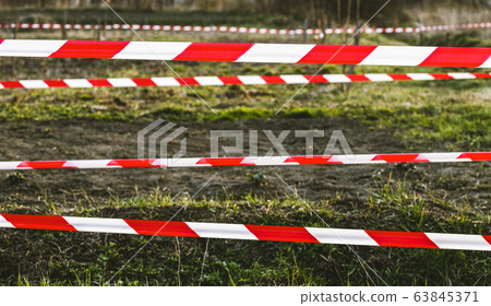 quarantine tape on field stay at home coronavirus 63845371