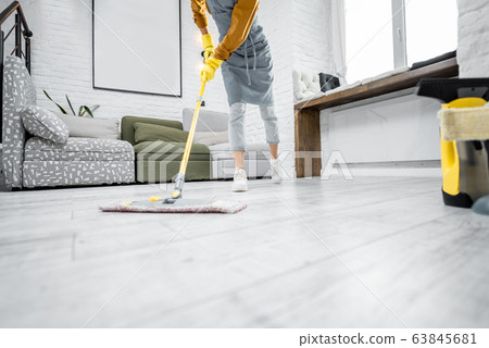 Woman washing flooor with a mop Woman washing flooor with a mop 63845681