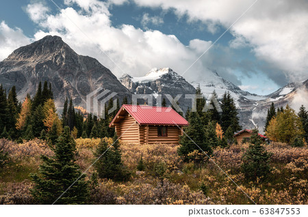 Wooden huts with rocky mountains in Assiniboine 63847553