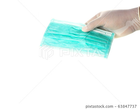 hand is giving medical face masks for covid-19 63847737