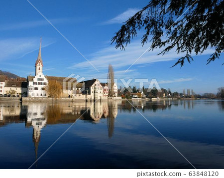 The small town of Stein am Rhein in northern Switzerland and the calm Rhine River (Schaffhausen) The small town of Stein am Rhein in northern Switzerland and the calm Rhine River (Schaffhausen) 63848120