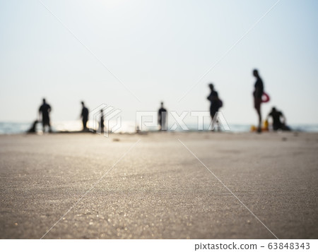 Silhouette People Family on beach sunlight Holiday background  63848343
