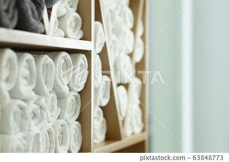 Towels in closet in barbershop, free space 63848773