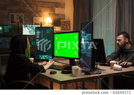 Dangerous female hacker in writing a malware Dangerous female hacker in writing a malware 63849171