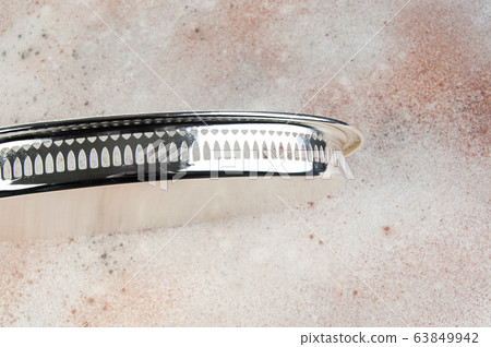 Antique silver plated tray on concrete background. Antique silver plated tray on concrete background. 63849942