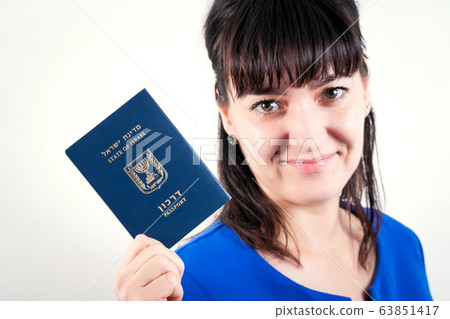 Israel passport in the hand of woman 63851417