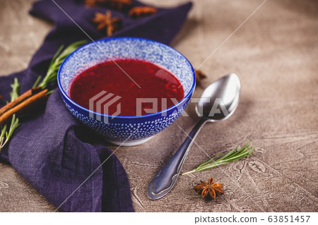 Fresh cranberry apple sauce in blue bowl Fresh cranberry apple sauce in blue bowl 63851457