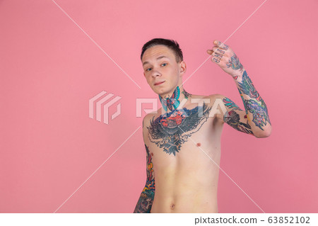 Portrait of young man with freaky appearance on pink background Portrait of young man with freaky appearance on pink background 63852102