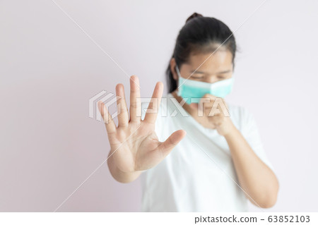 The women wear a medical mask for protection the The women wear a medical mask for protection the 63852103