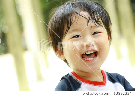 Boys playing in the water Boys playing in the water 63852334