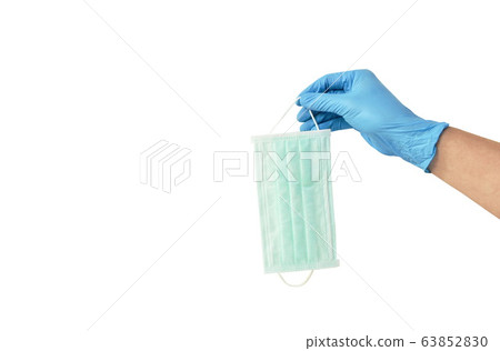 hand in blue rubber glove holding hygienic mask for protection nose and mouth on white background 63852830