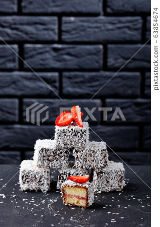 Lamingtons vanilla sponge mini cakes, copy space Lamingtons vanilla sponge mini cakes, copy space 63854674