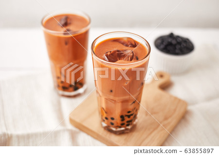 Milk Bubble Tea with Tapioca Pearls. . Milk Bubble Tea with Tapioca Pearls. . 63855897