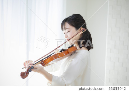 Woman violin playing playing Woman violin playing playing 63855942