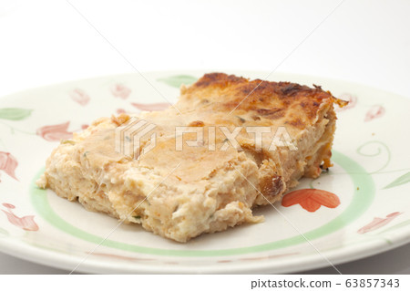 baked pasta with fish with its aluminum tray 63857343