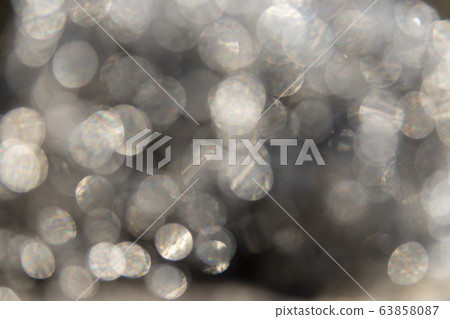 Grey Abstract bokeh light effect on dark background. Grey Abstract bokeh light effect on dark background. 63858087