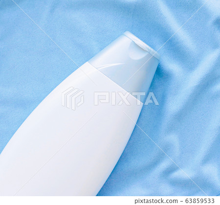 Blank label shampoo bottle or shower gel mockup on blue silk background, beauty product and body care cosmetics Blank label shampoo bottle or shower gel mockup on blue silk background, beauty product and body care cosmetics 63859533