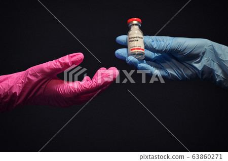 Woman Hand With Glove Giving Coronavirus Vaccine Woman Hand With Glove Giving Coronavirus Vaccine 63860271