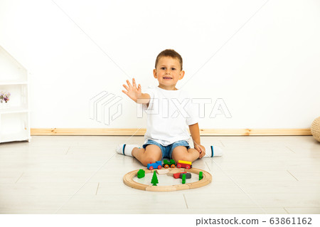 Boy playing with toys indoors at home 63861162