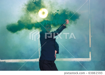 Pasadoble, latin solo dance and contemporary dance - Young beautiful female dancing into smoke cloud Pasadoble, latin solo dance and contemporary dance - Young beautiful female dancing into smoke cloud 63861593