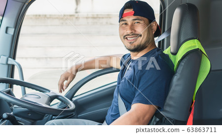 The driver is smiling. 63863711