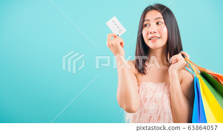 Portrait asian beautiful woman smiling holding 63864057