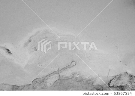 Close-up of White cement crack wall and peeled paint caused by water and sunlight. Peel wall of White house paint with black stain. Black and White of Texture background. 63867554