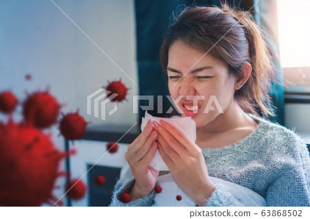 Sick asian woman have hight fever flu and sneezing Sick asian woman have hight fever flu and sneezing 63868502
