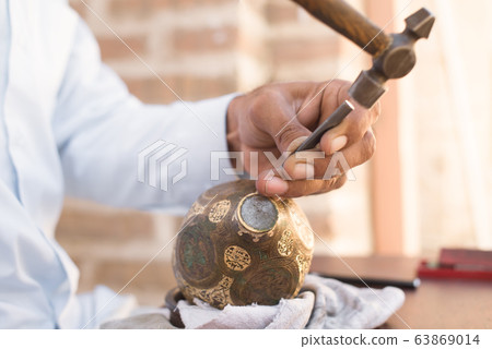 chaser of copper at work 63869014