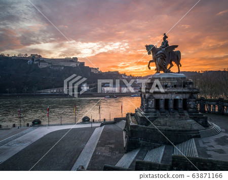 Colorful Sunrise burning sky Koblenz City historic monument German Corner where river rhine and mosele flow together Colorful Sunrise burning sky Koblenz City historic monument German Corner where river rhine and mosele flow together 63871166